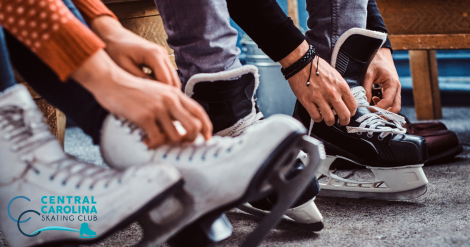 close-up shot of people putting ice skating skates on their feet
