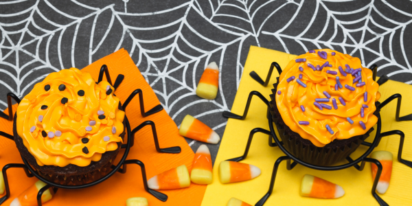 Halloween cupcakes, candy corn, spider web tablecloth